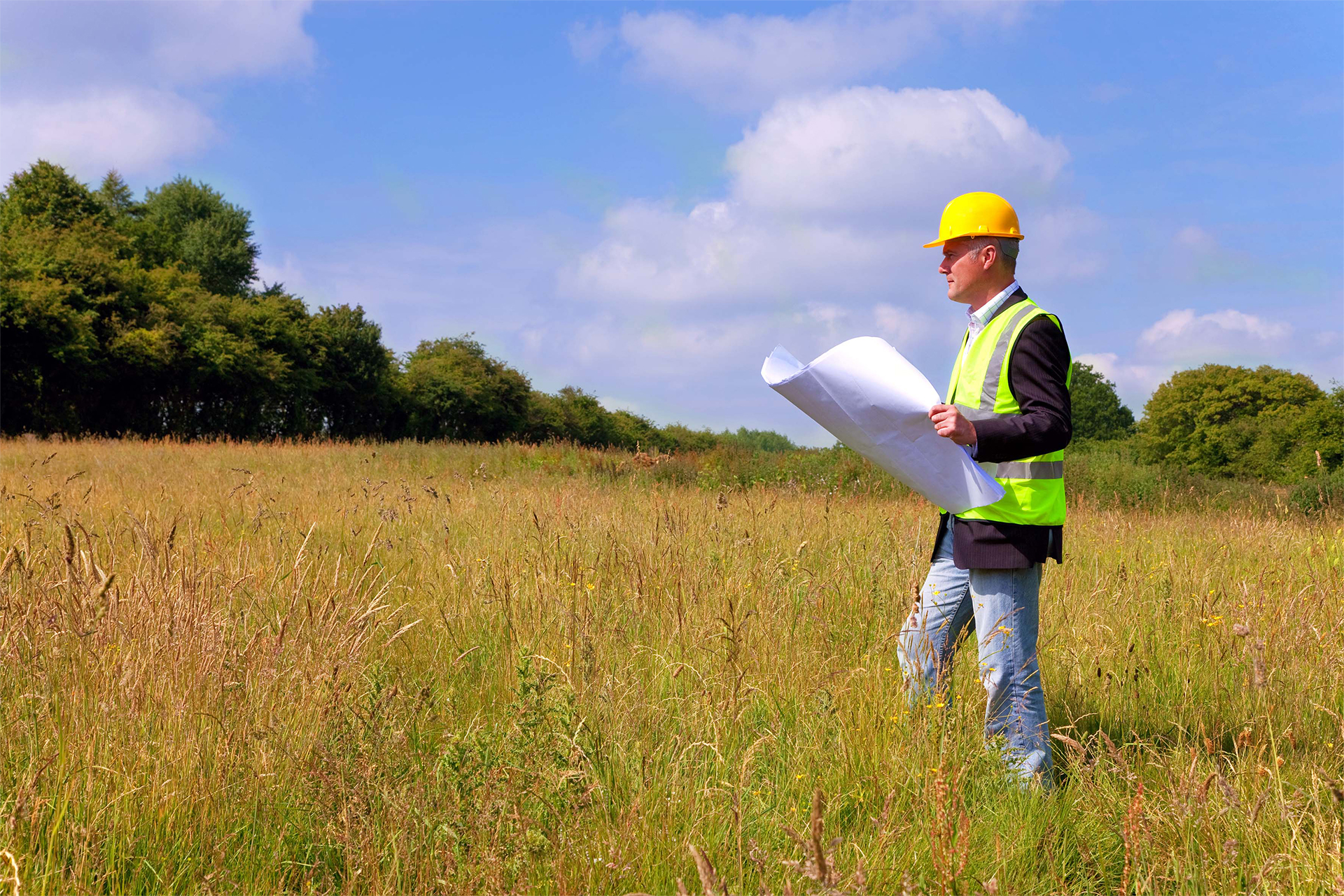 Site appraisal and valuation - man in field
